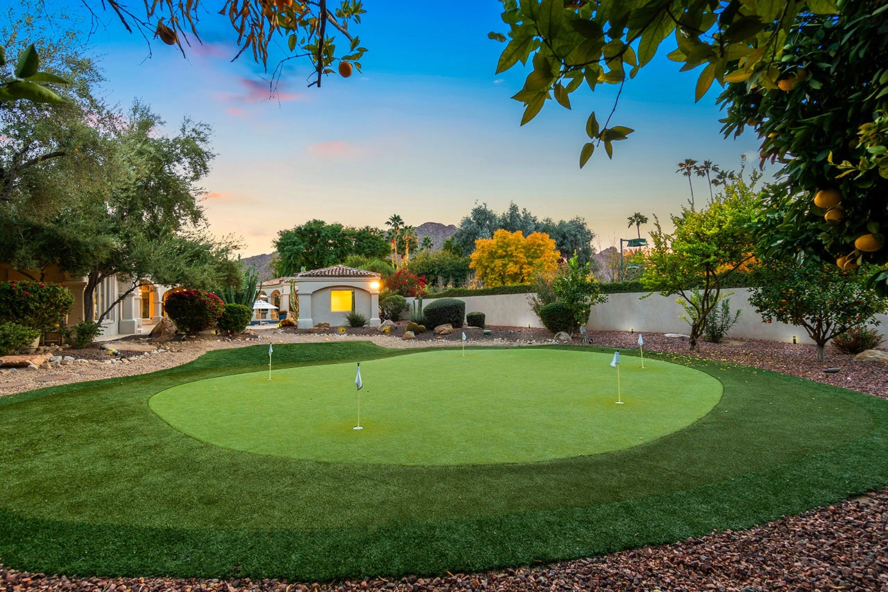 Custom backyard putting green integrated into a premium outdoor living space in Phoenix, Arizona.